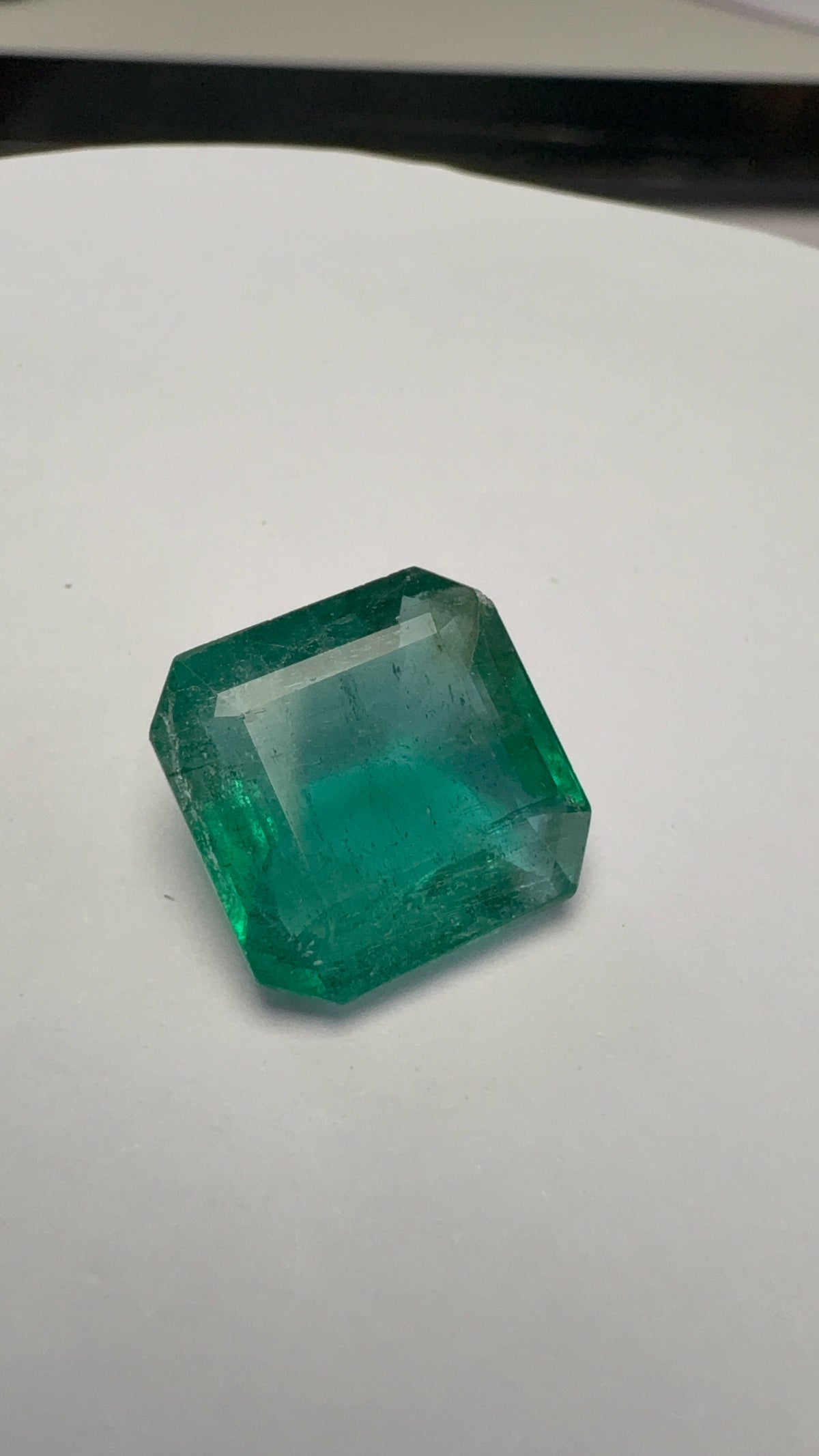 Emerald 6.74 carat EMER-127 alternate face-up view