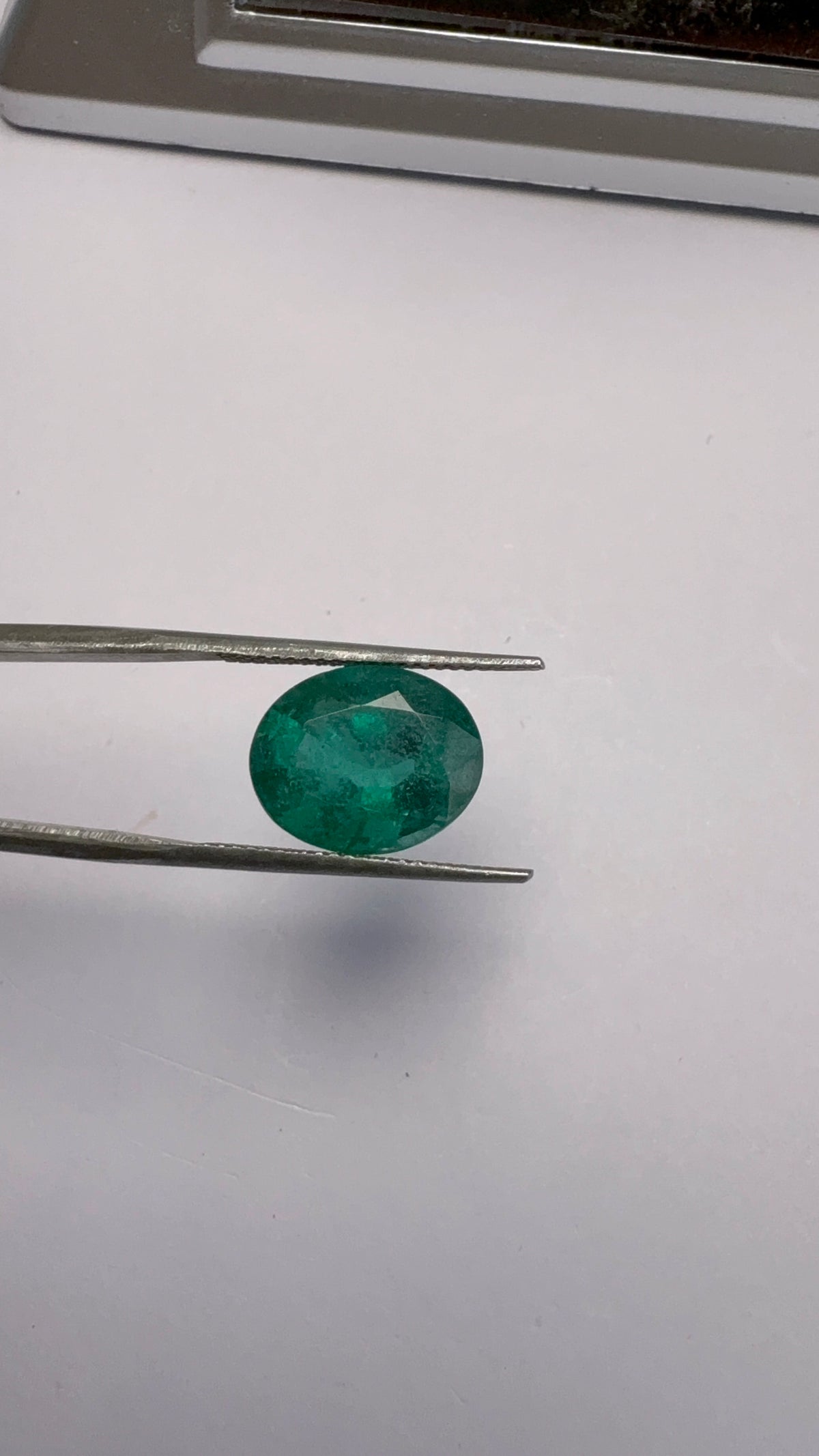 Emerald 5.65 carat EMER-134 alternate face-up view