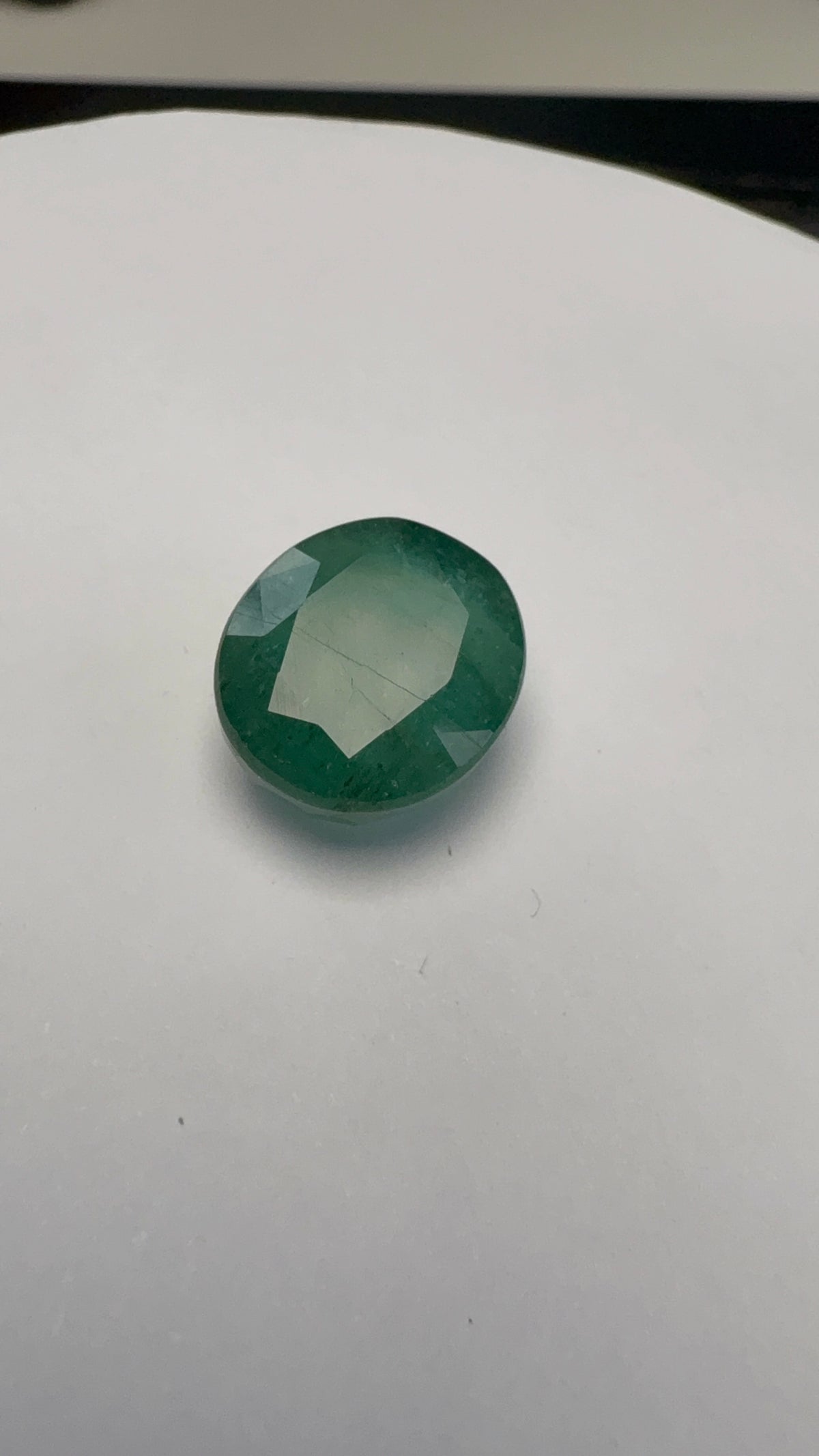 Emerald 7.69 carat EMER-39 alternate face-up view