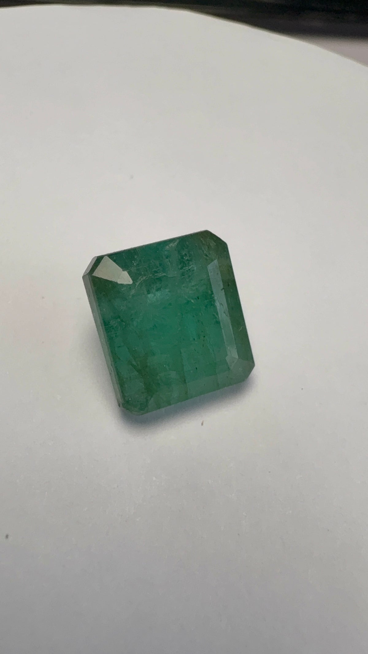 Emerald 6.76 carat EMER-64 alternate face-up view